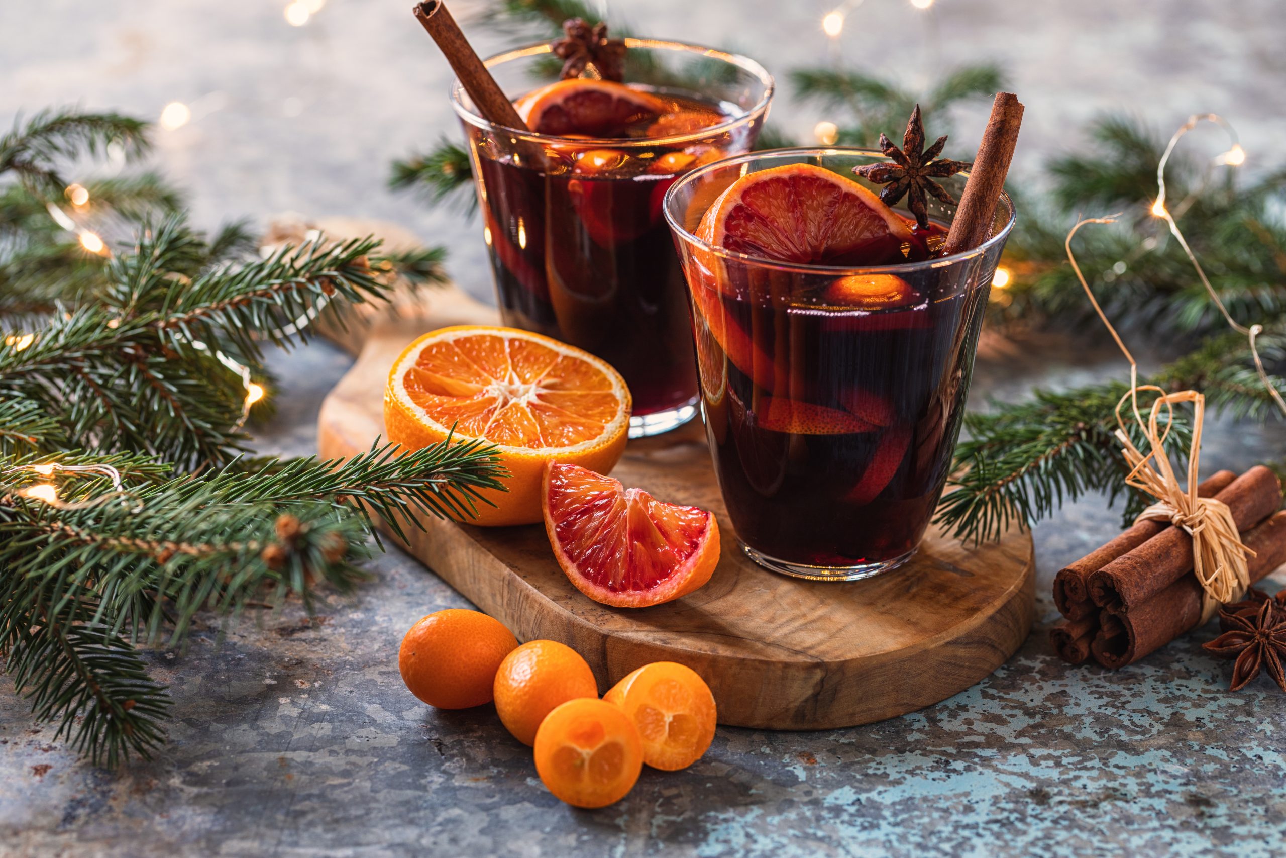 Glasses of Mulled Wine with Pine Branches and Oranges